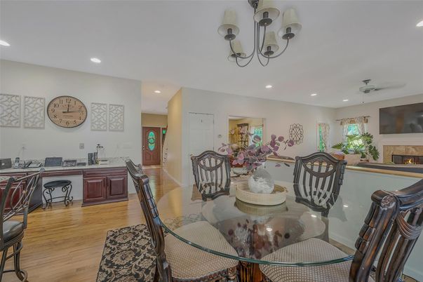 Chandelier, Dining room, Fireplace, Interior, Recessed Lighting, Wood Texture Flooring