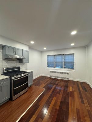 Interior, Kitchen, Marble Walls, Recessed Lighting, Stainless Steel Appliances, Wood Texture Flooring