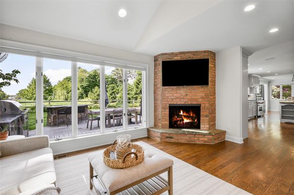 Fireplace, Interior, Living room, Recessed Lighting, Stone Walls, Wood Texture Flooring