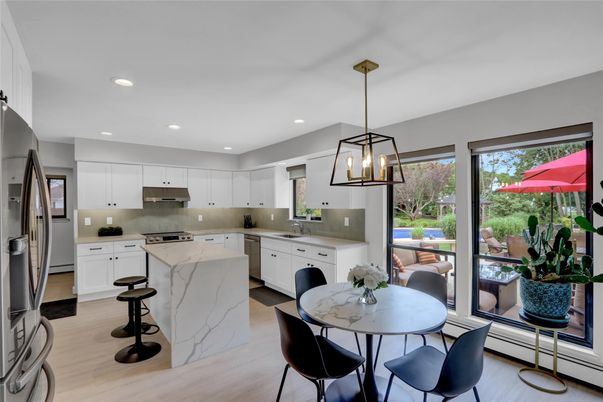 Dining room, Interior, Kitchen, Pendant Lights, Recessed Lighting, Stainless Steel Appliances, Wood Texture Flooring