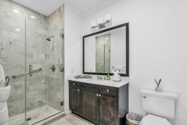 Bathroom, Dual Sink Vanities, Glass Shower, Interior, Marble Walls, Recessed Lighting