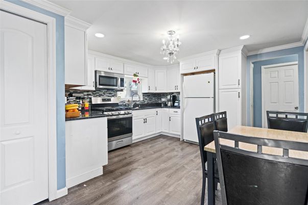 Chandelier, Interior, Kitchen, Recessed Lighting, Stainless Steel Appliances, Wood Texture Flooring