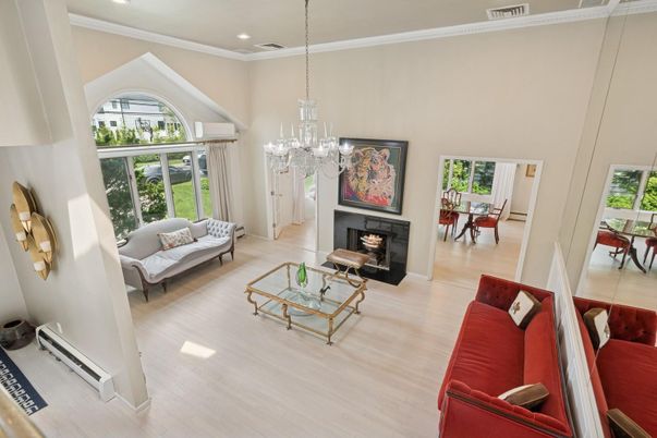Chandelier, Dining room, Fireplace, Interior, Living room, Pendant Lights, Recessed Lighting, Wood Texture Flooring