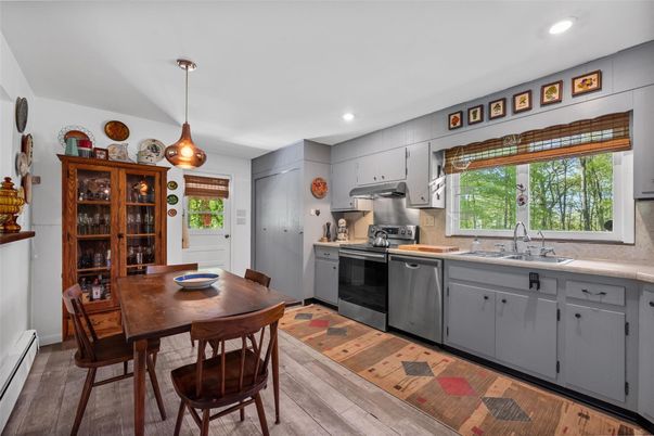Dining room, Interior, Kitchen, Pendant Lights, Recessed Lighting, Stainless Steel Appliances, Wood Texture Flooring