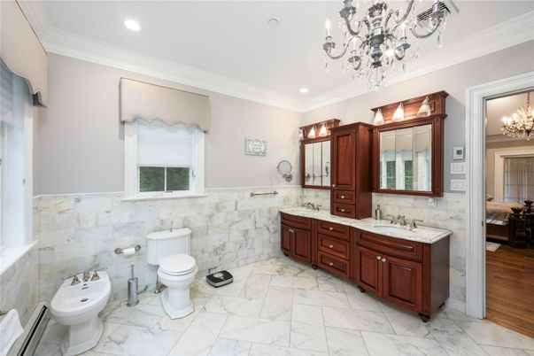 Bathroom, Chandelier, Dual Sink Vanities, Interior, Marble, Recessed Lighting, Wood Texture Flooring