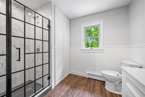 Bathroom, Glass Shower, Interior, Marble Walls, Wood Texture Flooring