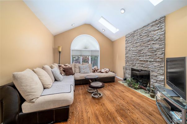 Fireplace, Interior, Living room, Recessed Lighting, Stone Walls, Wood Texture Flooring