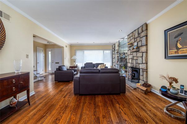 Fireplace, Interior, Living room, Recessed Lighting, Stone Walls, Wood Texture Flooring