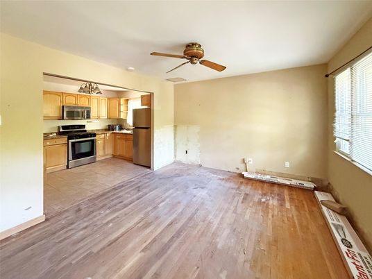 Empty room, Interior, Kitchen, Stainless Steel Appliances, Wood Texture Flooring