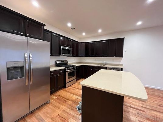 Interior, Kitchen, Recessed Lighting, Stainless Steel Appliances, Wood Texture Flooring