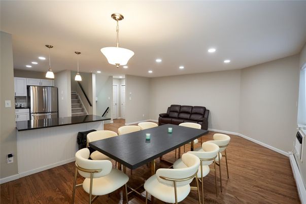 Dining room, Interior, Kitchen, Pendant Lights, Recessed Lighting, Stainless Steel Appliances, Wood Texture Flooring