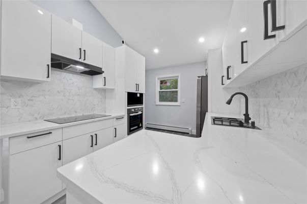 Interior, Kitchen, Marble Walls, Recessed Lighting, Stainless Steel Appliances