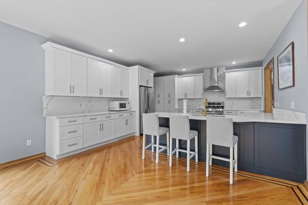 Interior, Kitchen, Marble Walls, Recessed Lighting, Stainless Steel Appliances, Wood Texture Flooring