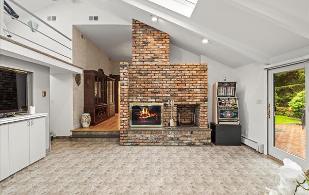 Fireplace, Interior, Recessed Lighting, Stone Walls, Wood Texture Flooring
