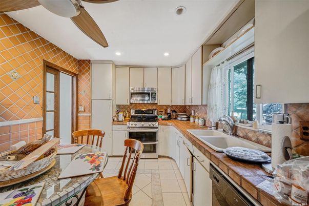 Interior, Kitchen, Recessed Lighting, Stainless Steel Appliances, Tile Countertops