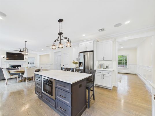 Chandelier, Dining room, Fireplace, Interior, Kitchen, Pendant Lights, Recessed Lighting, Stainless Steel Appliances, Wood Texture Flooring