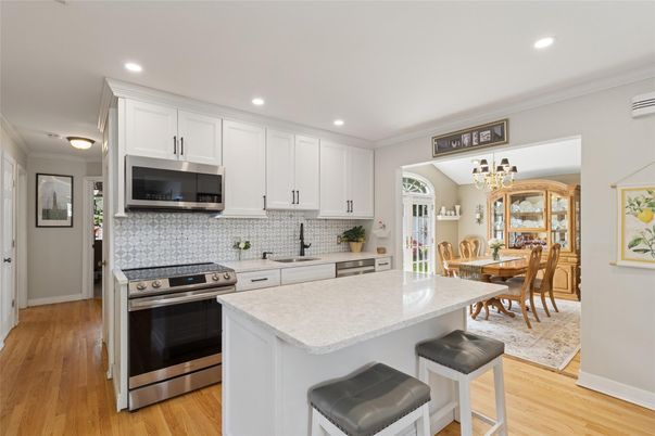 Chandelier, Dining room, Interior, Kitchen, Recessed Lighting, Stainless Steel Appliances, Wood Texture Flooring