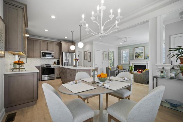 Chandelier, Dining room, Fireplace, Interior, Kitchen, Living room, Pendant Lights, Recessed Lighting, Stainless Steel Appliances, Wood Texture Flooring