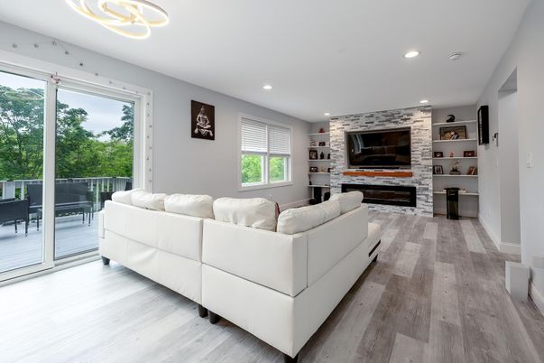 Fireplace, Interior, Living room, Pendant Lights, Recessed Lighting, Stone Walls, Wood Texture Flooring