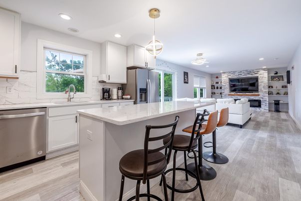 Fireplace, Interior, Kitchen, Living room, Pendant Lights, Recessed Lighting, Stainless Steel Appliances, Wood Texture Flooring
