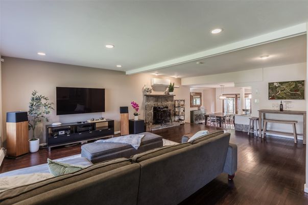 Dining room, Fireplace, Interior, Living room, Recessed Lighting, Wood Texture Flooring
