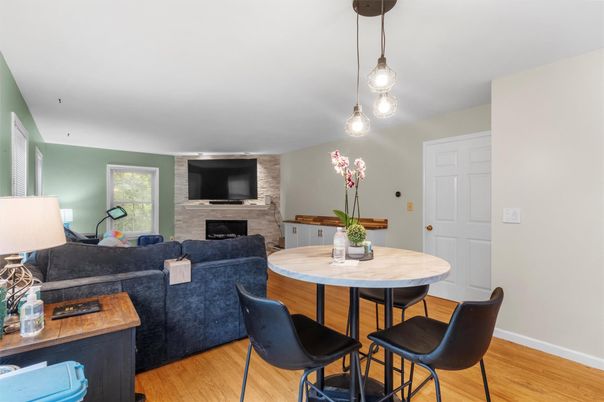 Dining room, Fireplace, Interior, Living room, Pendant Lights, Stone Walls, Wood Texture Flooring