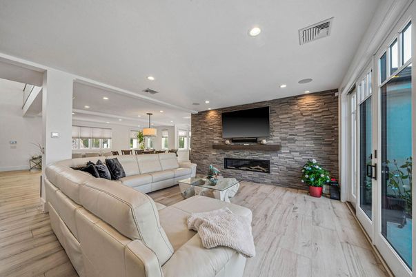 Fireplace, Interior, Living room, Pendant Lights, Recessed Lighting, Stone Walls, Wood Texture Flooring