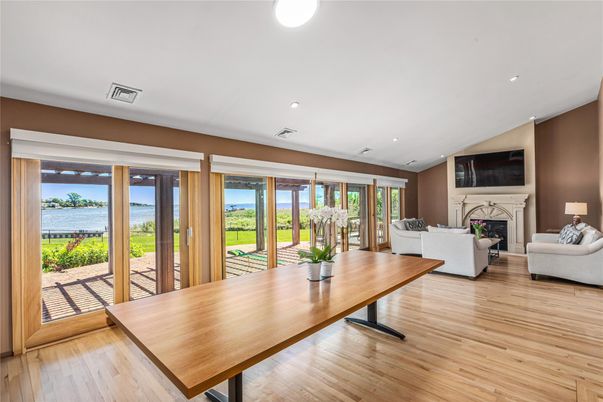 Fireplace, Interior, Living room, Recessed Lighting, Water, Wood Texture Flooring