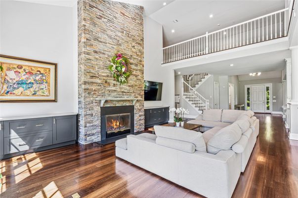 Fireplace, Interior, Living room, Recessed Lighting, Stone Walls, Wood Texture Flooring
