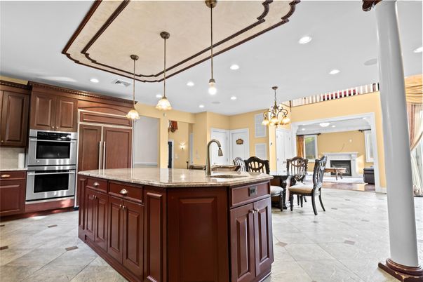Chandelier, Dining room, Fireplace, Interior, Kitchen, Pendant Lights, Recessed Lighting, Stainless Steel Appliances