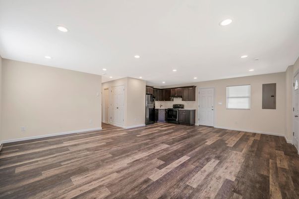Empty room, Interior, Kitchen, Recessed Lighting, Stainless Steel Appliances, Wood Texture Flooring