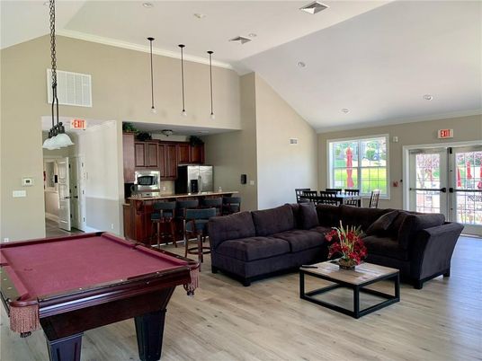 Billiard Table, Dining room, Game Room, Interior, Kitchen, Living room, Pendant Lights, Recessed Lighting, Stainless Steel Appliances, Wood Texture Flooring