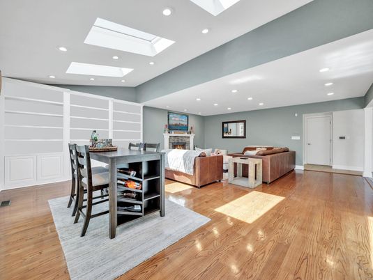 Dining room, Fireplace, Interior, Living room, Recessed Lighting, Wood Texture Flooring
