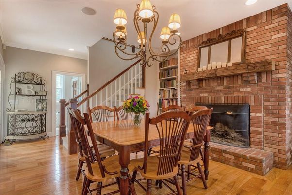 Chandelier, Dining room, Fireplace, Interior, Recessed Lighting, Stone Walls, Wood Texture Flooring