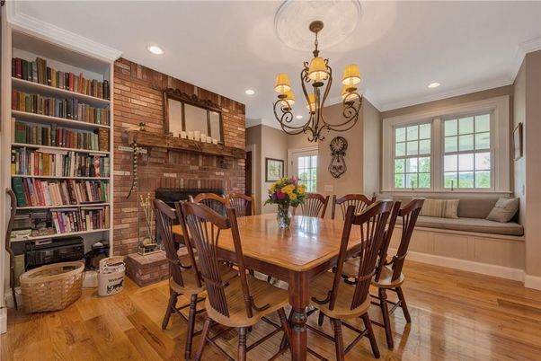 Chandelier, Dining room, Fireplace, Interior, Recessed Lighting, Stone Walls, Wood Texture Flooring