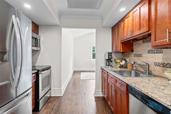Interior, Kitchen, Recessed Lighting, Washer, Wood Texture Flooring