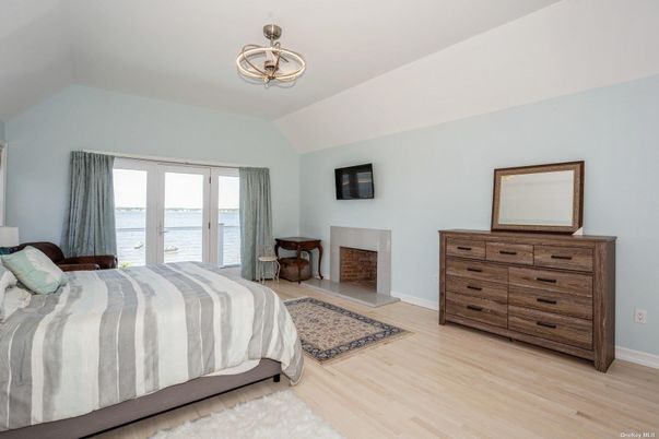 Bedroom, Fireplace, Interior, Pendant Lights, Water, Wood Texture Flooring