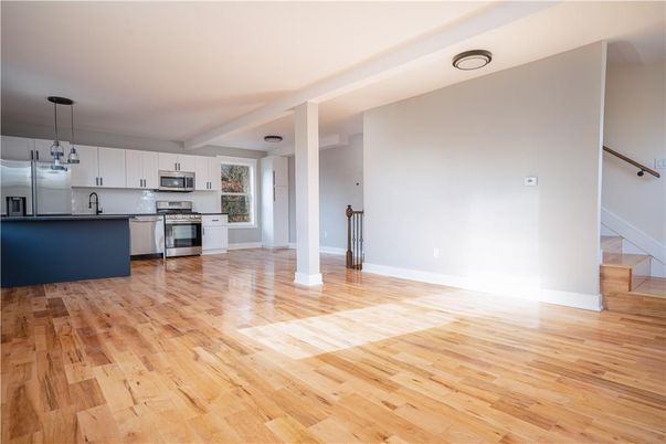 Empty room, Interior, Kitchen, Pendant Lights, Stainless Steel Appliances, Wood Texture Flooring