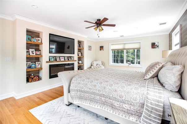Bedroom, Fireplace, Interior, Recessed Lighting, Wood Texture Flooring