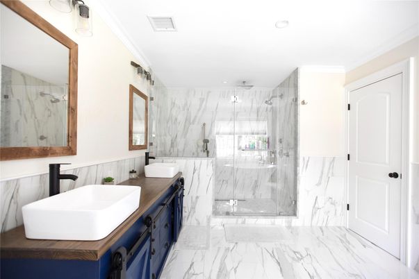 Bathroom, Dual Sink Vanities, Glass Shower, Interior, Marble, Marble Walls, Recessed Lighting