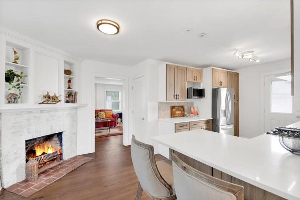 Fireplace, Interior, Kitchen, Stainless Steel Appliances, Wood Texture Flooring