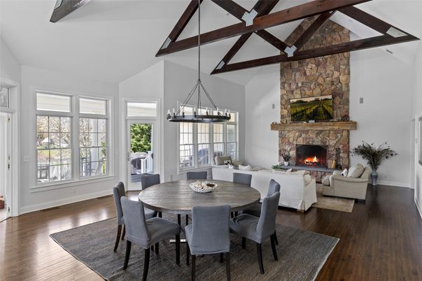 Chandelier, Dining room, Fireplace, Interior, Living room, Pendant Lights, Stone Walls, Wooden Beams, Wood Texture Flooring