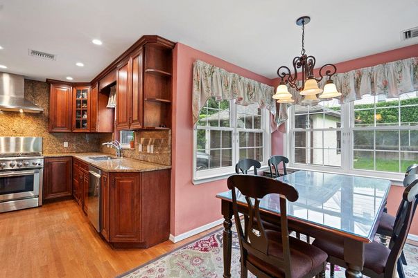 Chandelier, Dining room, Interior, Kitchen, Recessed Lighting, Stainless Steel Appliances, Wood Texture Flooring