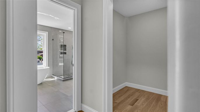 Bathroom, Free Standing Baths, Glass Shower, Interior, Recessed Lighting, Wood Texture Flooring
