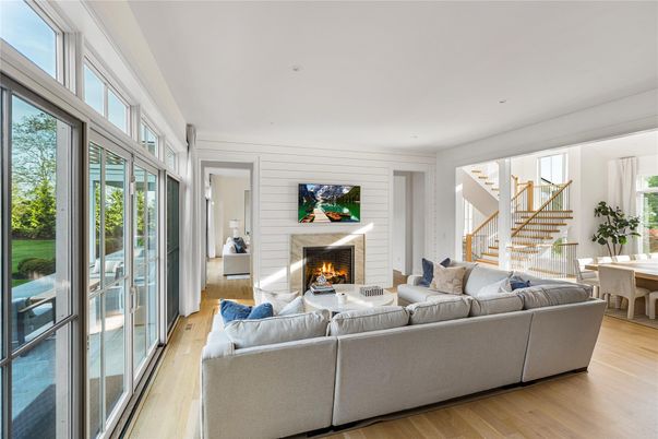 Fireplace, Interior, Living room, Recessed Lighting, Stone Walls, Wood Texture Flooring