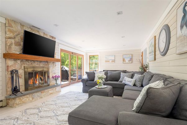 Fireplace, Interior, Living room, Recessed Lighting, Stone Walls, Wood Texture Flooring