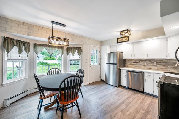 Dining room, Interior, Kitchen, Pendant Lights, Stainless Steel Appliances, Stone Walls, Wood Texture Flooring