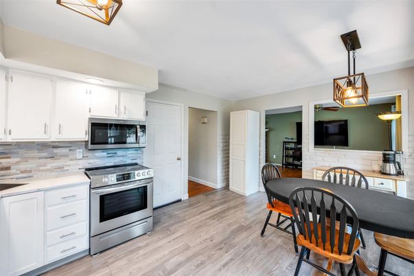 Dining room, Interior, Kitchen, Pendant Lights, Stainless Steel Appliances, Wood Texture Flooring