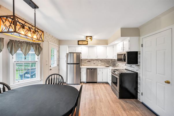Dining room, Interior, Kitchen, Pendant Lights, Stainless Steel Appliances, Wood Texture Flooring