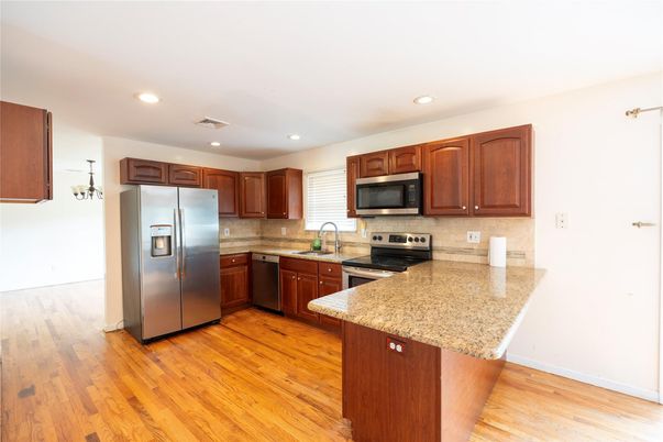Interior, Kitchen, Recessed Lighting, Stainless Steel Appliances, Wood Texture Flooring